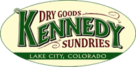 A sign for dry goods kennedy sundries in lake city, colorado.