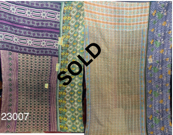 Four vibrant Kantha Quilts displayed side by side, with the middle two marked as "SOLD." The quilts feature various intricate designs and a reference number "23007" is visible in the bottom left.