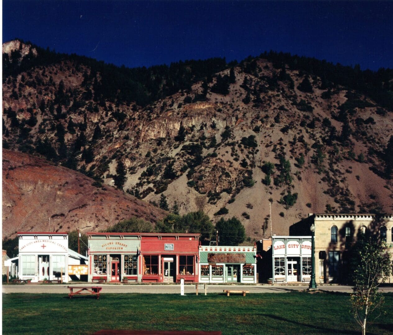 A group of buildings in the middle of a field.